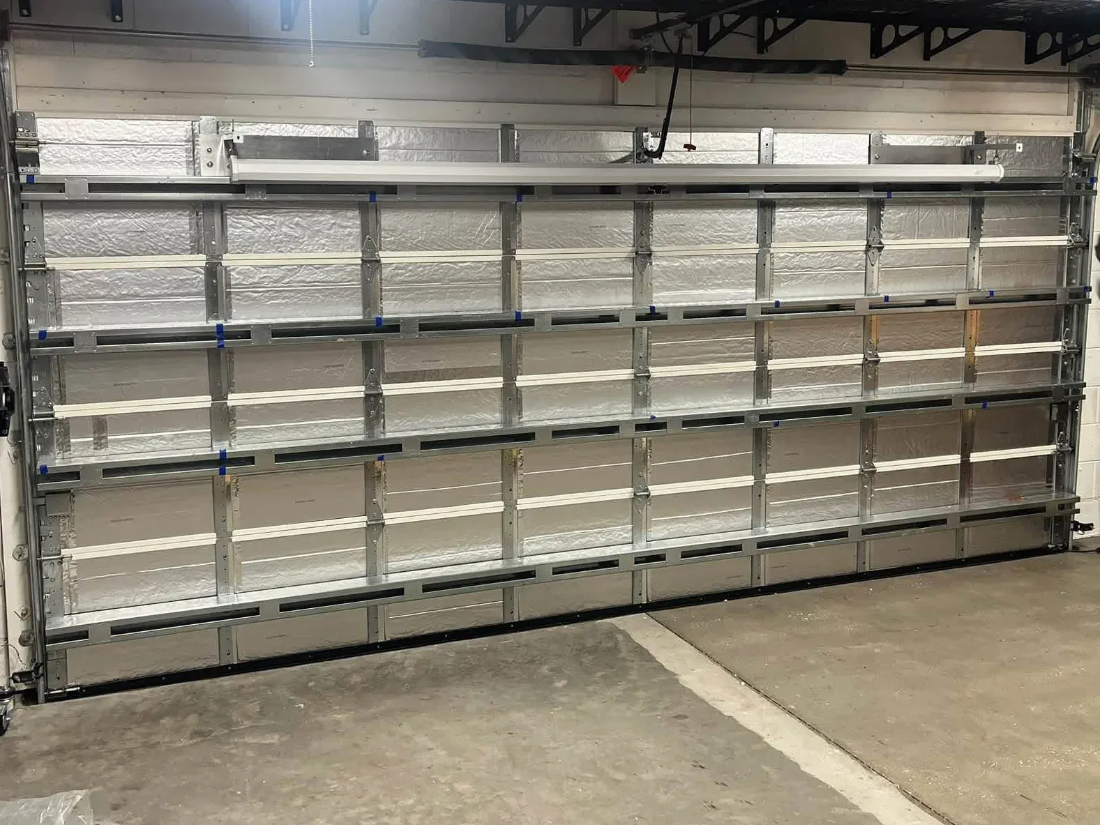 New insulated garage door sections from inside, the springs above