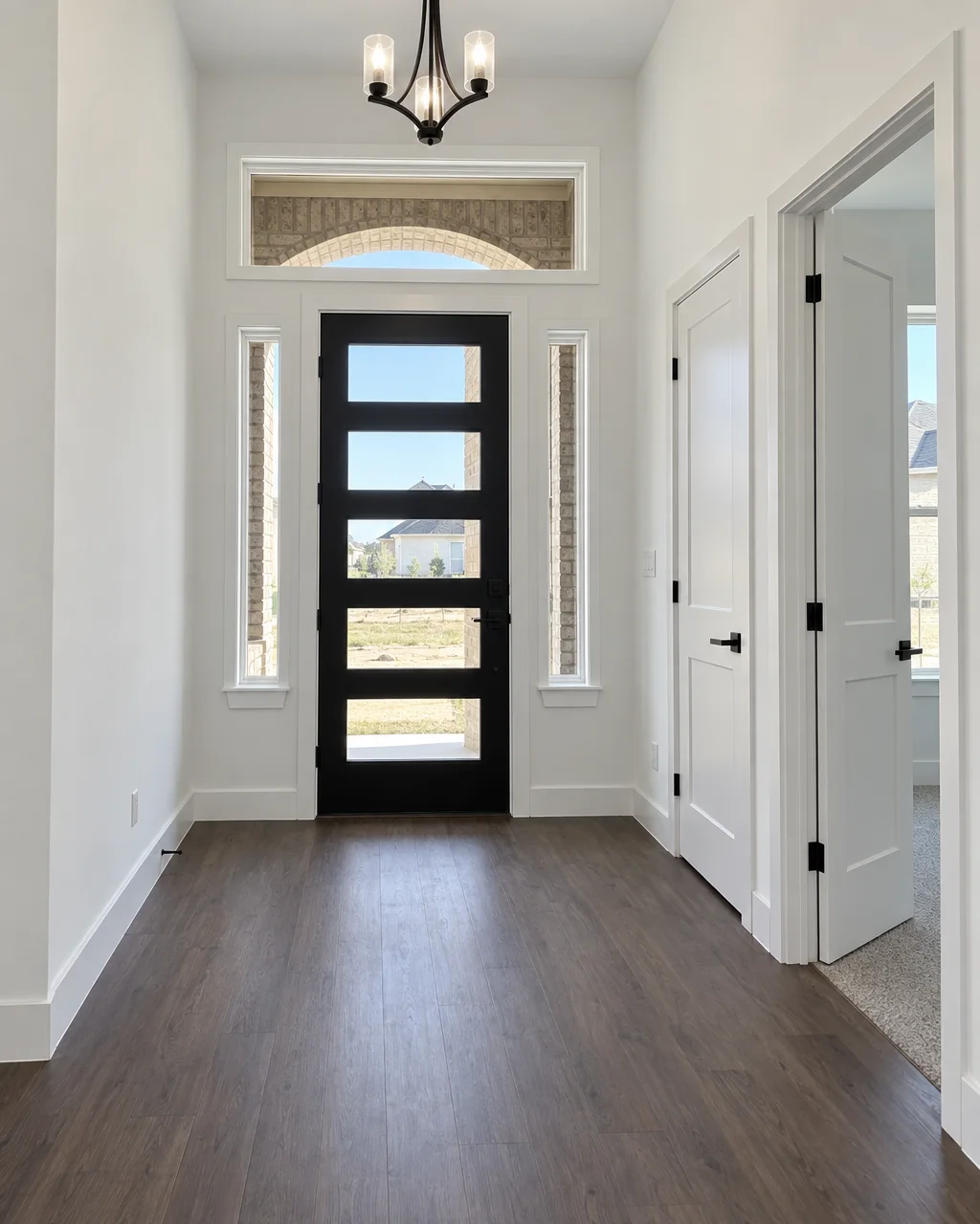 A hallway with new white interior doors