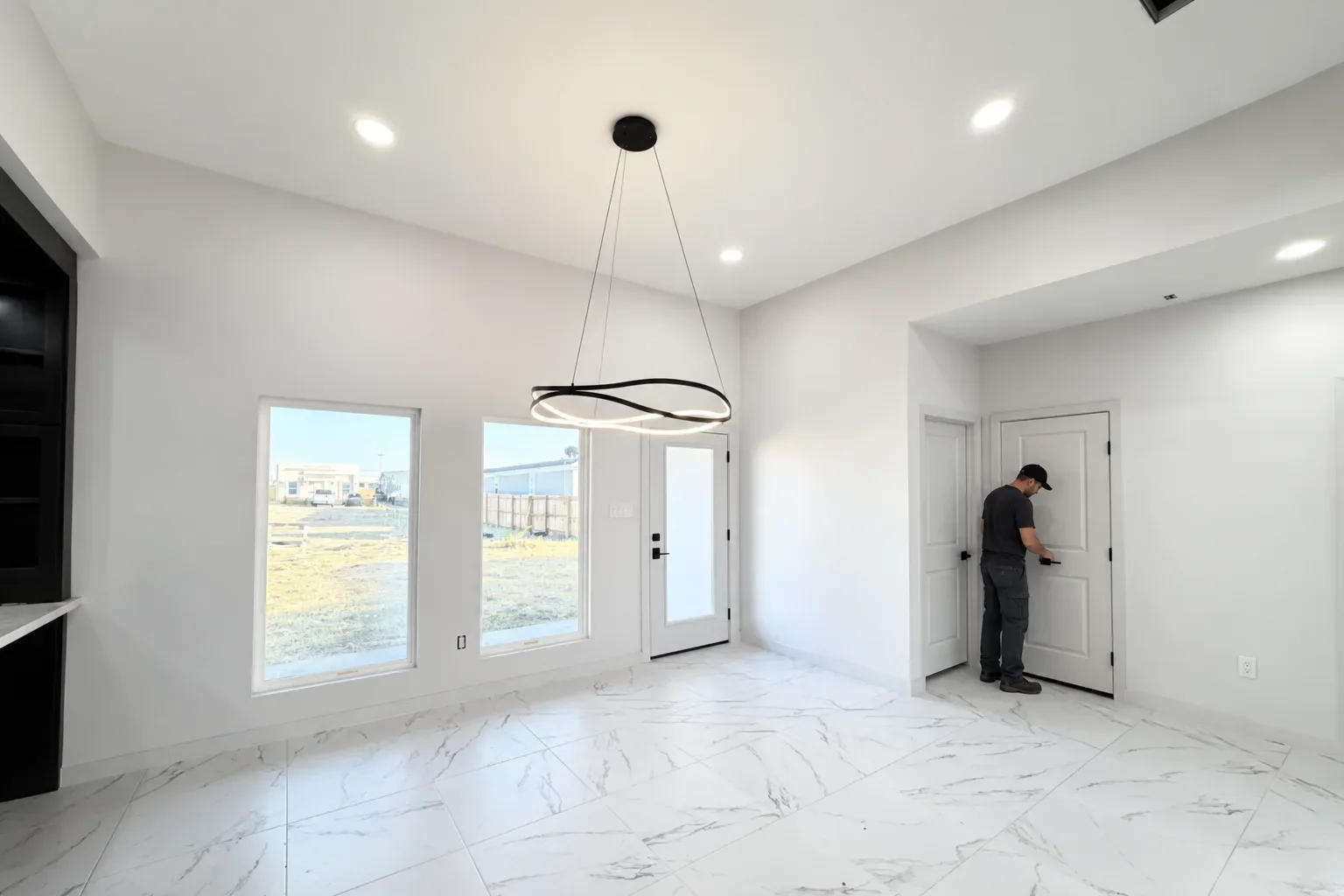 A technician checking that an interior door latches