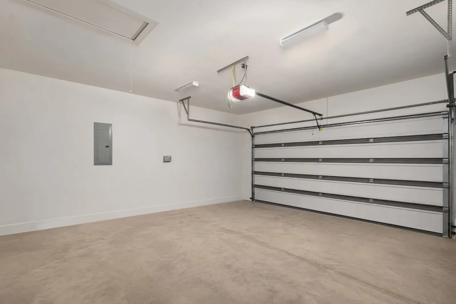 A garage from inside, the sectional door and its opener