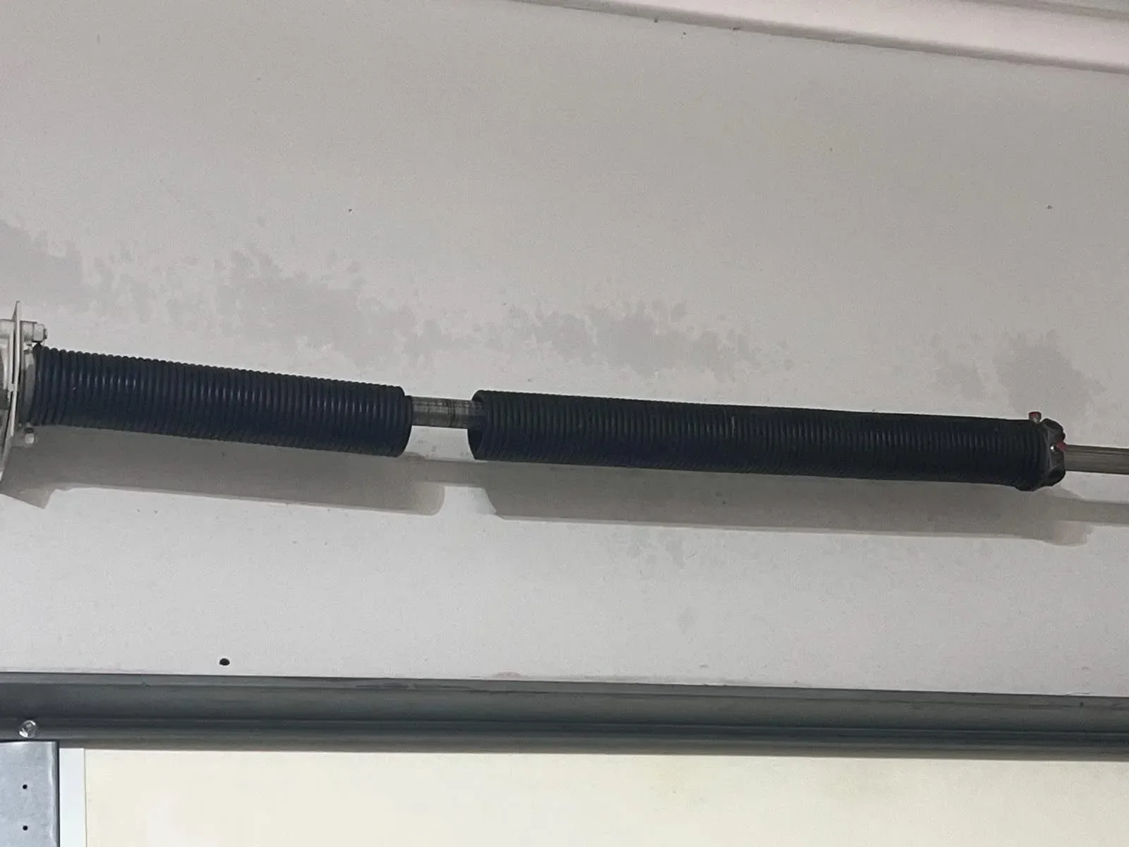 A broken torsion spring, close up